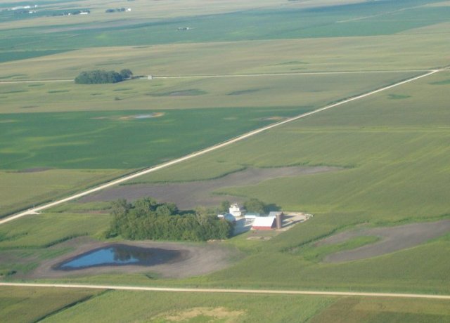 Farm real estate brokers see reason for optimism as commodity prices rise but warn there could be significant variability, especially in areas that struggled with wet weather this spring. 